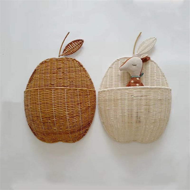 Apple shaped rattan wall baskets in brown and white with plush toys