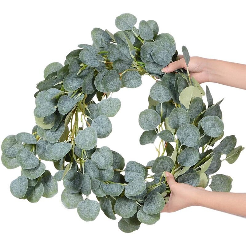 Artificial eucalyptus garland with sage green leaves and small white flowers
