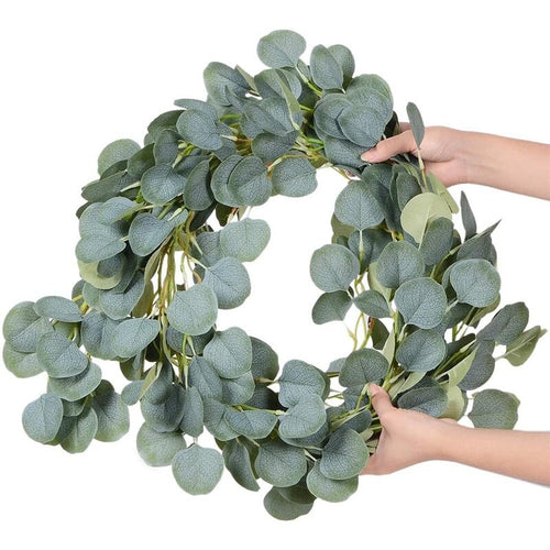 Artificial eucalyptus garland with sage green leaves and small white flowers