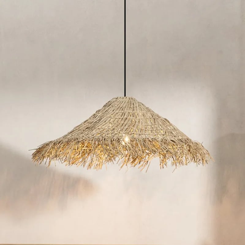 Rounded Asian style pendant light hand woven in golden beige wicker