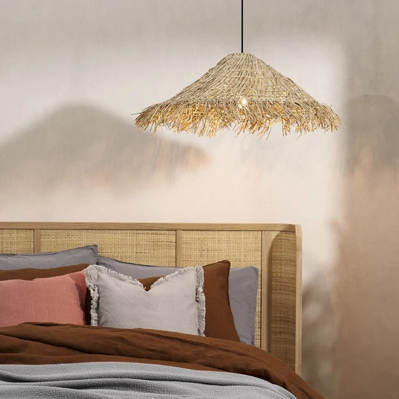 Rounded Asian style pendant light hand woven in golden beige wicker