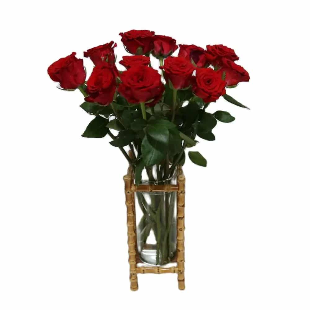 Glass cylinder held in a four post bamboo frame