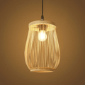 Handwoven bamboo lantern pendant light glowing warm