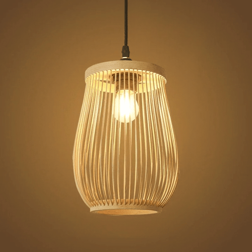 Handwoven bamboo lantern pendant light glowing warm