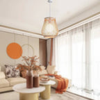 Handwoven bamboo lantern pendant light glowing warm