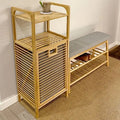 Tall bamboo storage cabinet with shelves and a slatted laundry compartment