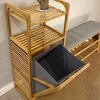 Tall bamboo storage cabinet with shelves and a slatted laundry compartment