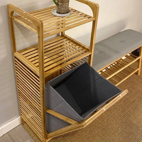 Tall bamboo storage cabinet with shelves and a slatted laundry compartment