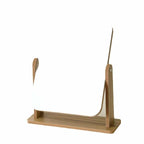 Rectangular bamboo vanity mirror tilting on a tray base
