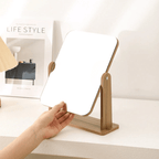 Rectangular bamboo vanity mirror tilting on a tray base