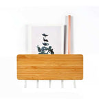 Bamboo wall key holder with a small shelf and five white hooks
