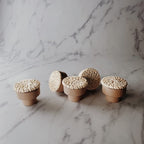 Set of beech wood knobs wrapped in white woven rattan