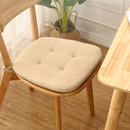 Beige thin polyester seat cushion with ties for a rattan chair