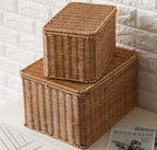 Stacked beige lidded woven storage boxes