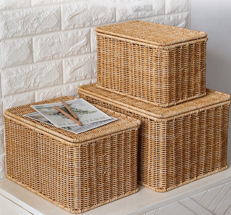 Stacked beige lidded woven storage boxes