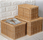 Stacked beige lidded woven storage boxes
