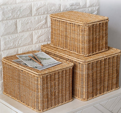 Stacked beige lidded woven storage boxes