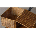 Stacked beige lidded woven storage boxes