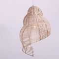 Beige open weave rattan pendant shaped like a conch seashell