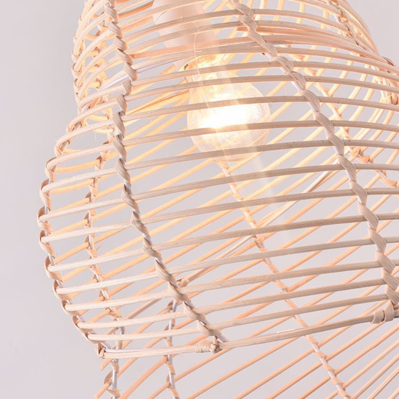 Beige open weave rattan pendant shaped like a conch seashell