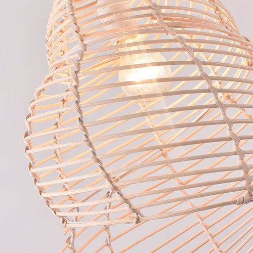 Beige open weave rattan pendant shaped like a conch seashell