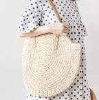 Roomy beige hand woven beach bag with sturdy handles