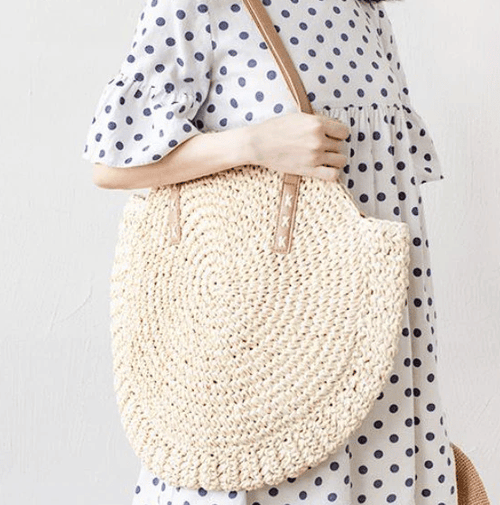 Roomy beige hand woven beach bag with sturdy handles