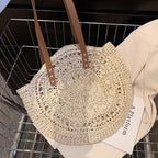 Roomy beige hand woven beach bag with sturdy handles