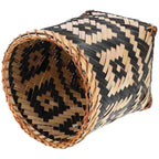 Cylinder bamboo wastebasket with black geometric woven patterns