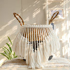 Black and natural belly basket with a fringe of white tassels