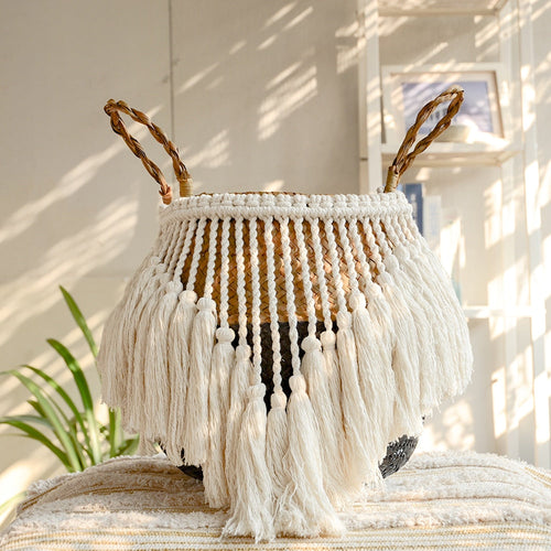 Black and natural belly basket with a fringe of white tassels
