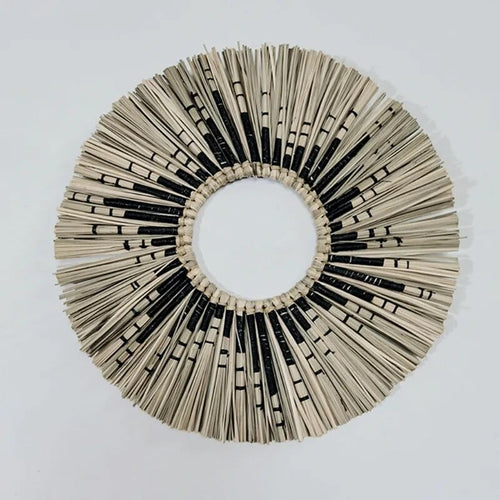 Round sunburst mirror with black and natural straw rays
