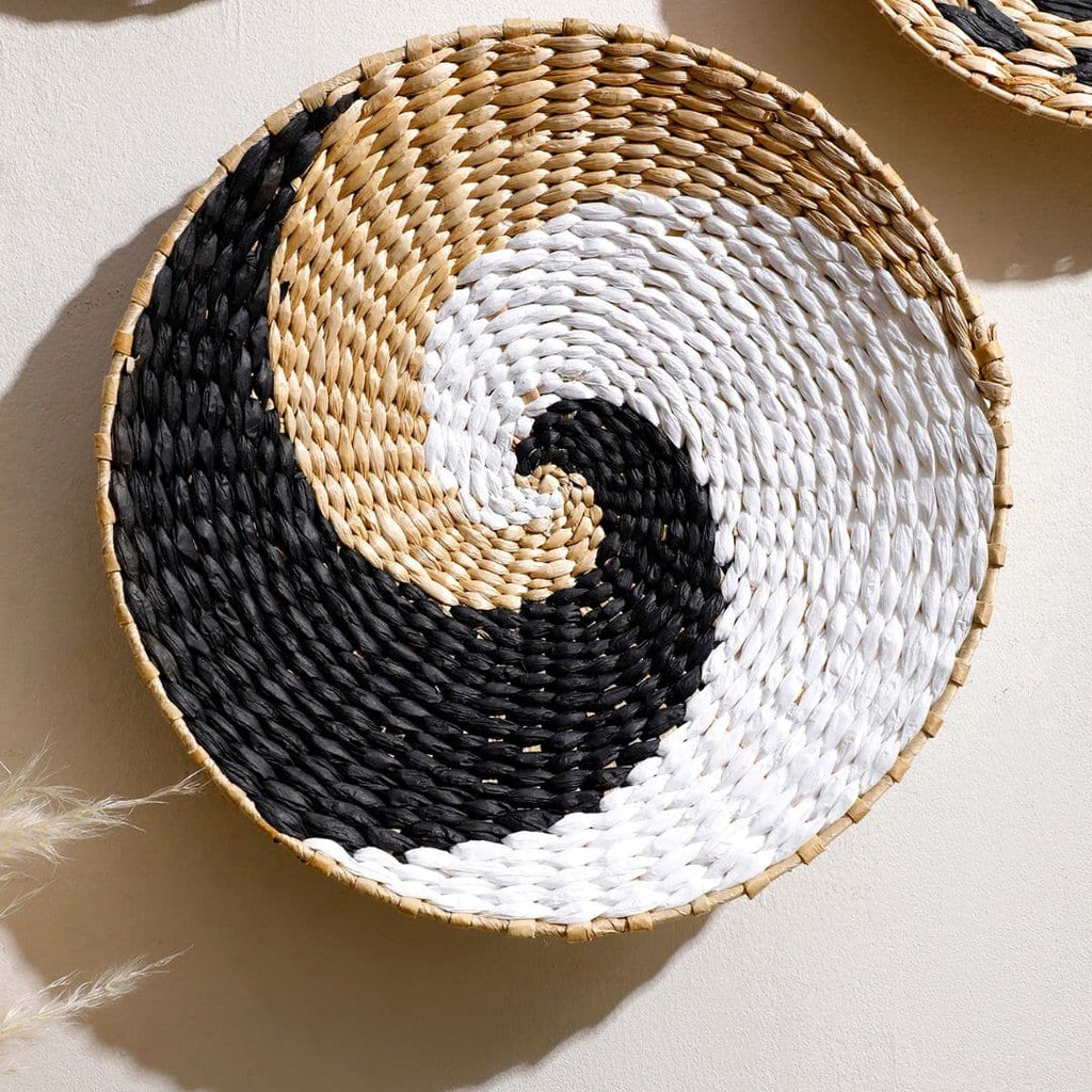 Round woven wall basket with black, white and natural spiral