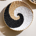 Round woven wall basket with black, white and natural spiral