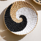 Round woven wall basket with black, white and natural spiral