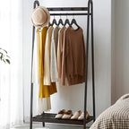 Tall black bamboo clothes rack with clean Asian inspired lines