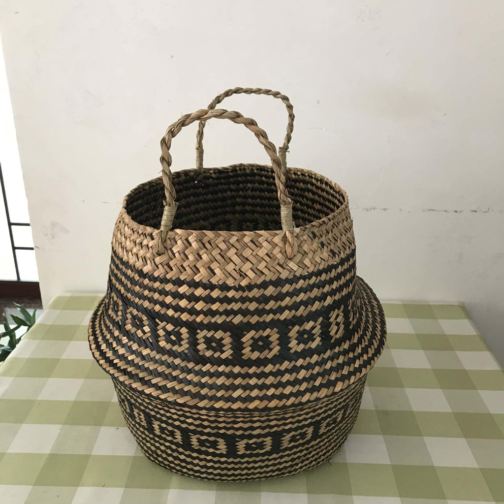 Woven belly basket with black geometric pattern and handles