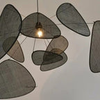 Large black hand woven rattan pendant light with leaf shaped arms