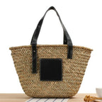 Black hand woven raffia straw handbag with two short handles