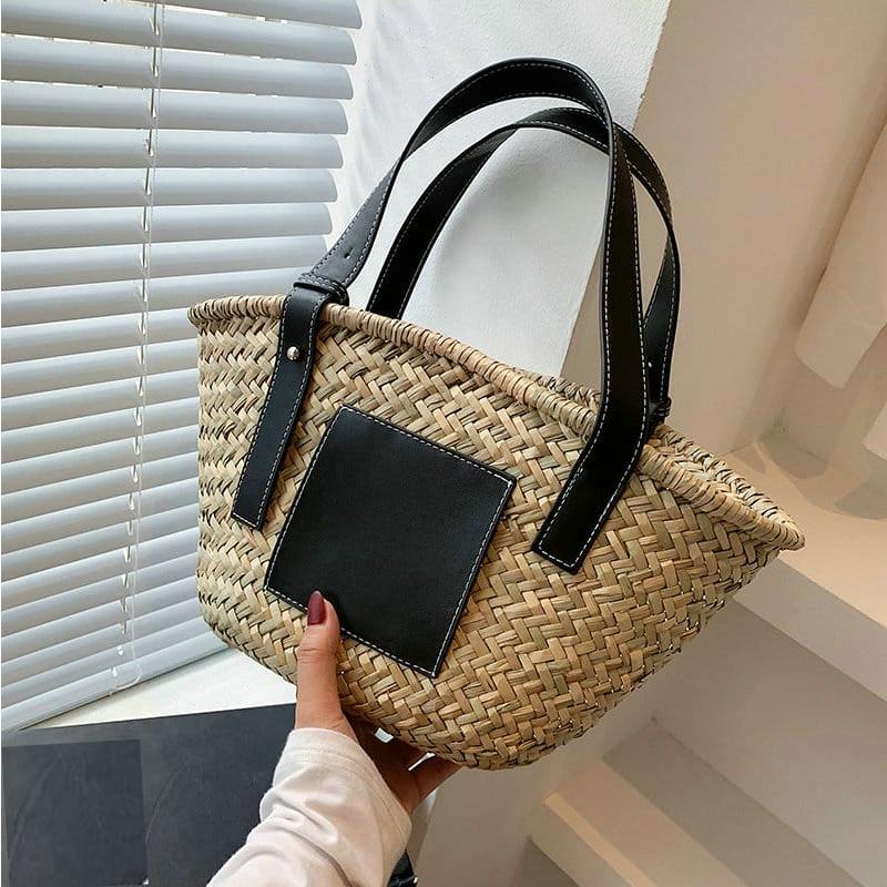 Black hand woven raffia straw handbag with two short handles
