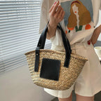 Black hand woven raffia straw handbag with two short handles