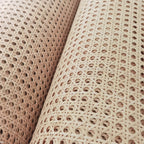 Roll of bleached rattan cane webbing with a round open mesh
