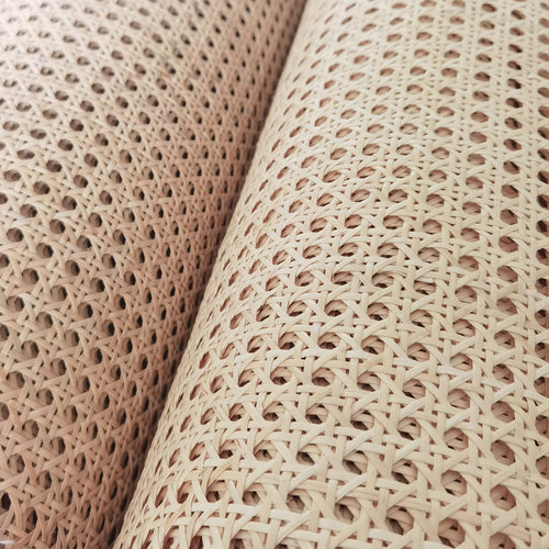 Roll of bleached rattan cane webbing with a round open mesh