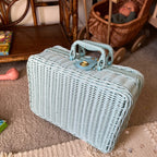 Small blue woven rattan box shaped like a retro suitcase with straps