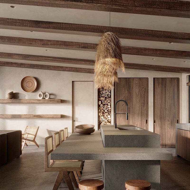 Row of three shaggy boho fringe pendants over a kitchen island