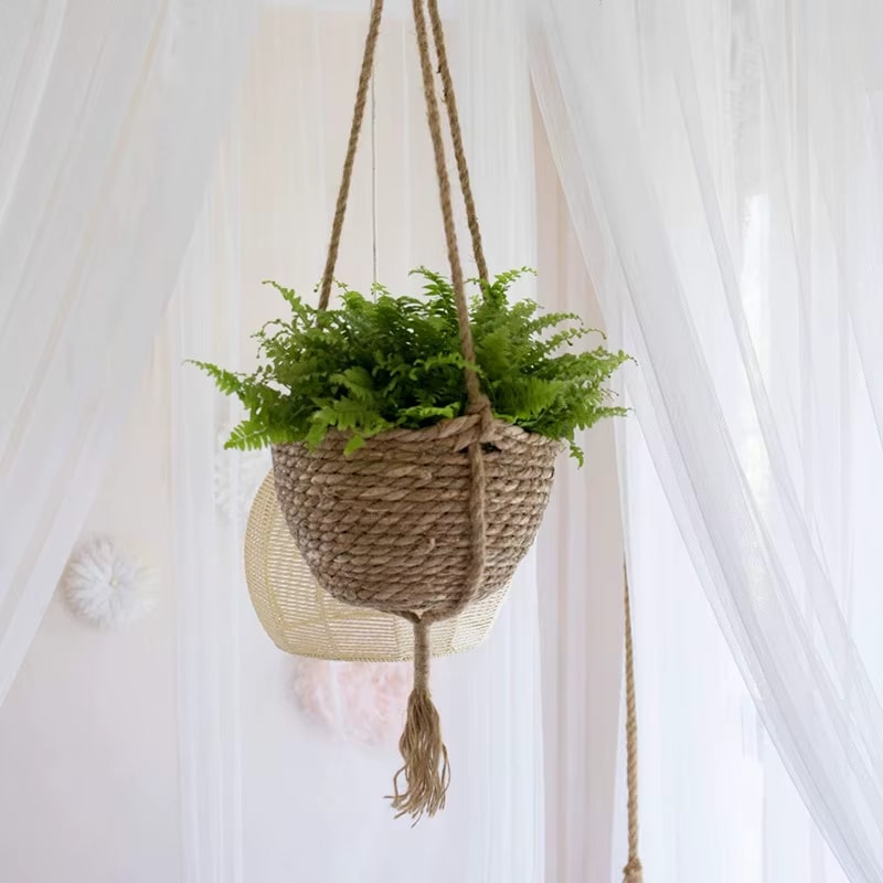 Round boho hanging planter hand woven in natural rattan