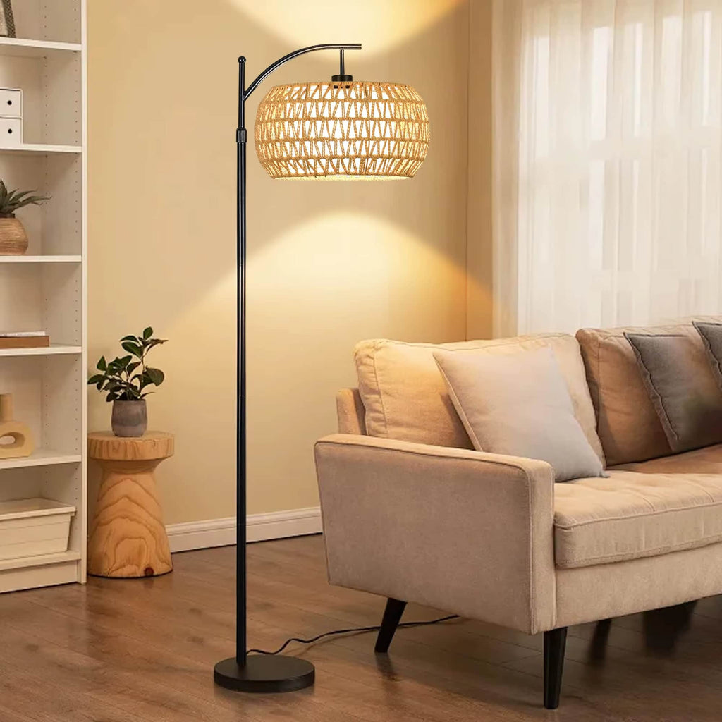 Boho floor lamp with a hand woven rattan shade on a slim black stand