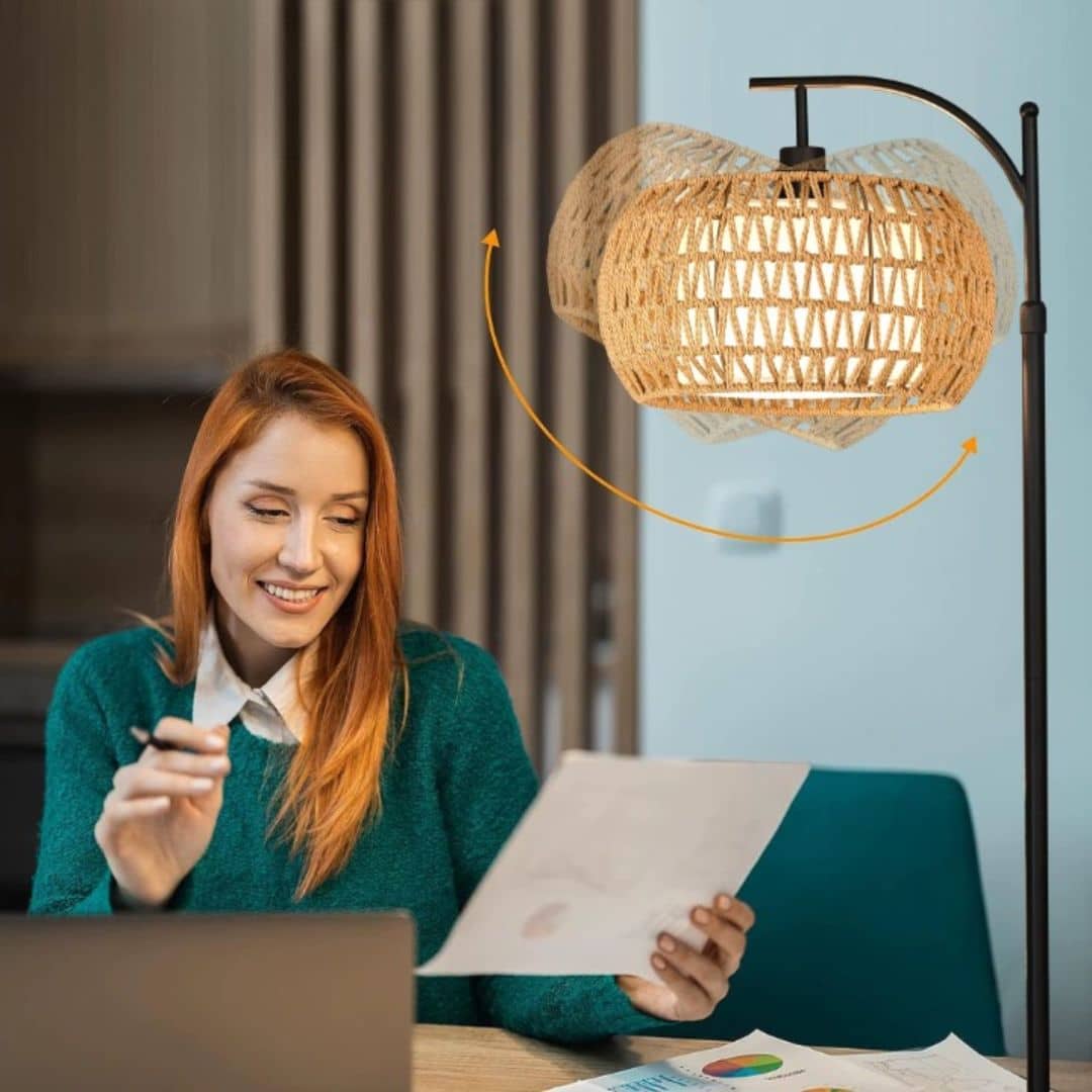 Boho floor lamp with a hand woven rattan shade on a slim black stand
