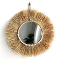 Round straw fringe mirror with a ring of wooden beads