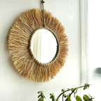 Round straw fringe mirror with a ring of wooden beads
